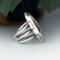 right side view, large oval wild horse magnesite gemstone silver statement ring, bezel set with stamped cutout wire accent